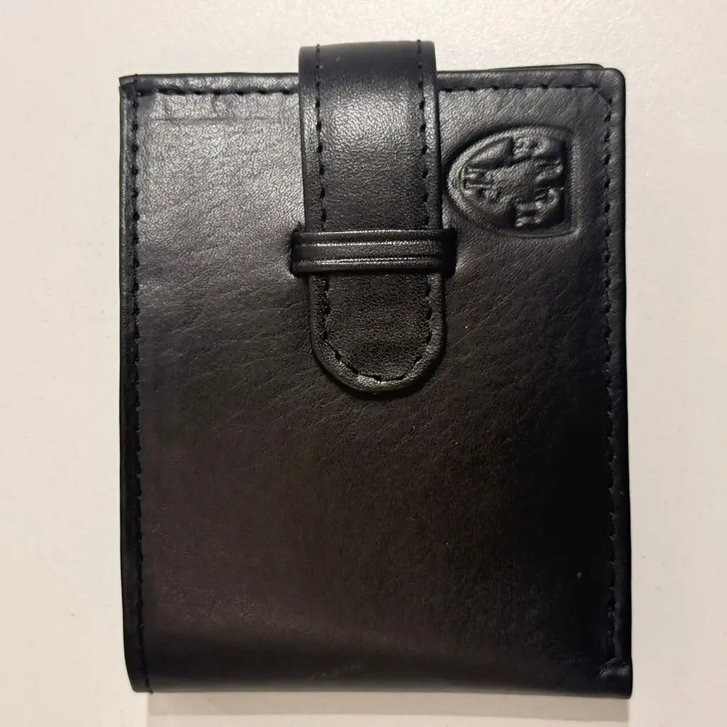 BILLETERA DE CUERO C/1VOL Y RAB (130) NEG